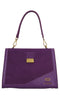 LA CARRIE Irregular medium bag in leather and suede
