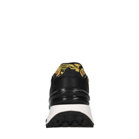 Sneakers in pelle, tessuto e altre materie 