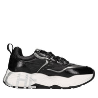 Sneakers in vernice e tessuto tecnico 