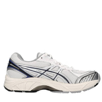 Sneakers in ecopelle e tessuto 