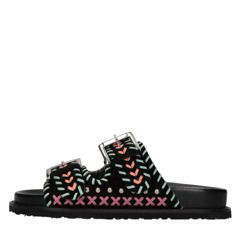 Mules in camoscio e pelle con borchie 