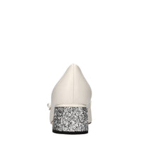 Décolleté in pelle e glitter 