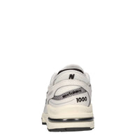 Sneakers in ecopelle e tessuto 