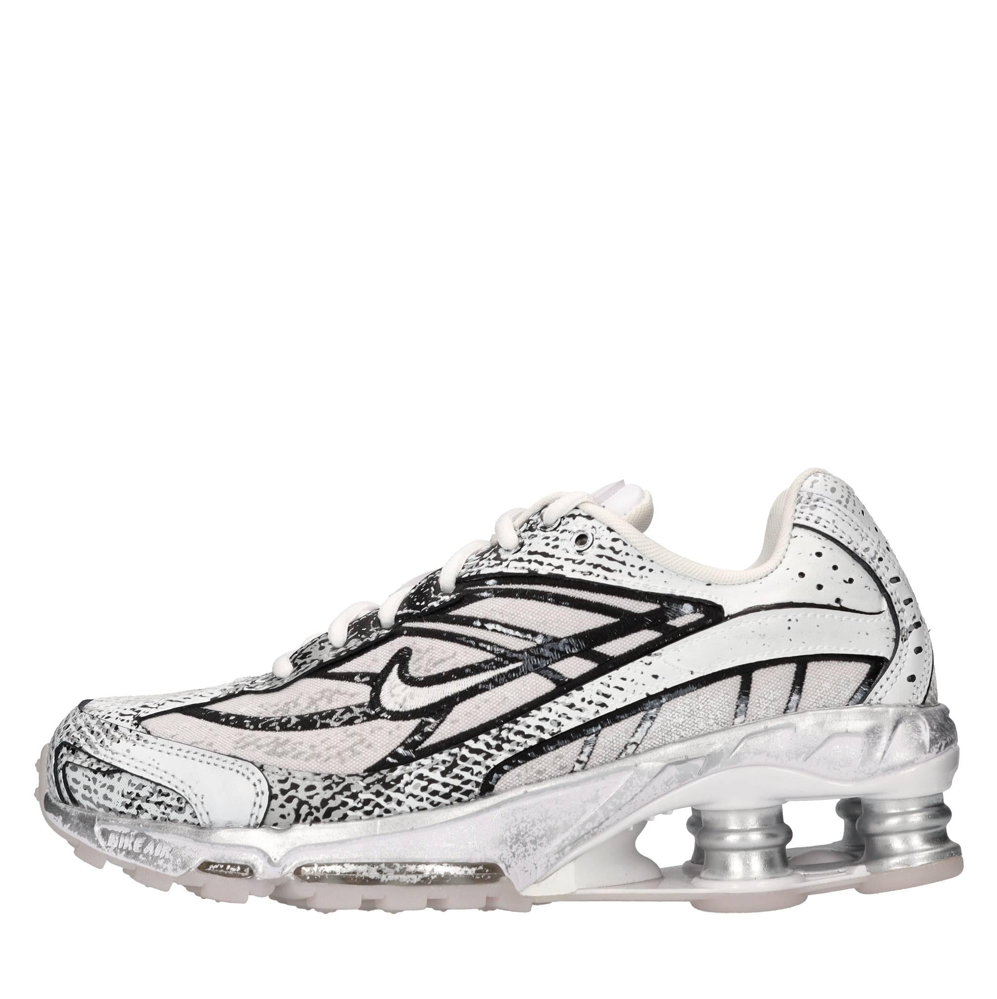 Sneakers in ecopelle e tessuto 