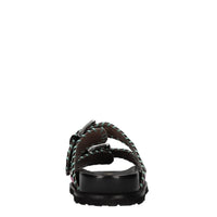 Mules in camoscio e pelle con borchie 