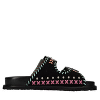 Mules in camoscio e pelle con borchie 