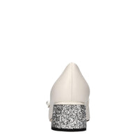 Décolleté in pelle e glitter 