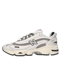 Sneakers in ecopelle e tessuto 