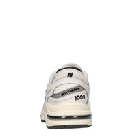 Sneakers in ecopelle e tessuto 