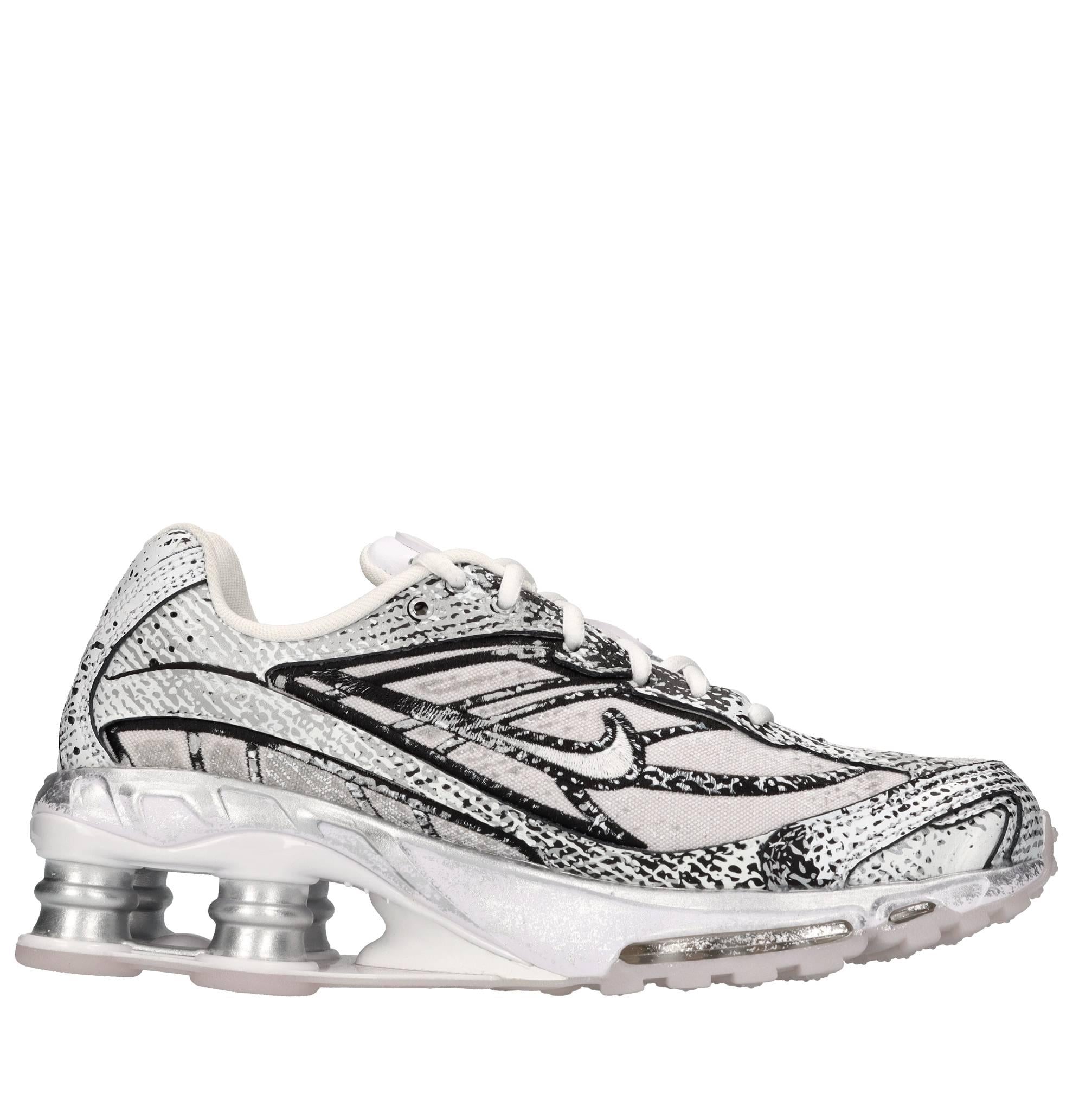 Sneakers in ecopelle e tessuto 