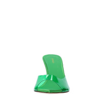 Mules in pelle e PVC. 