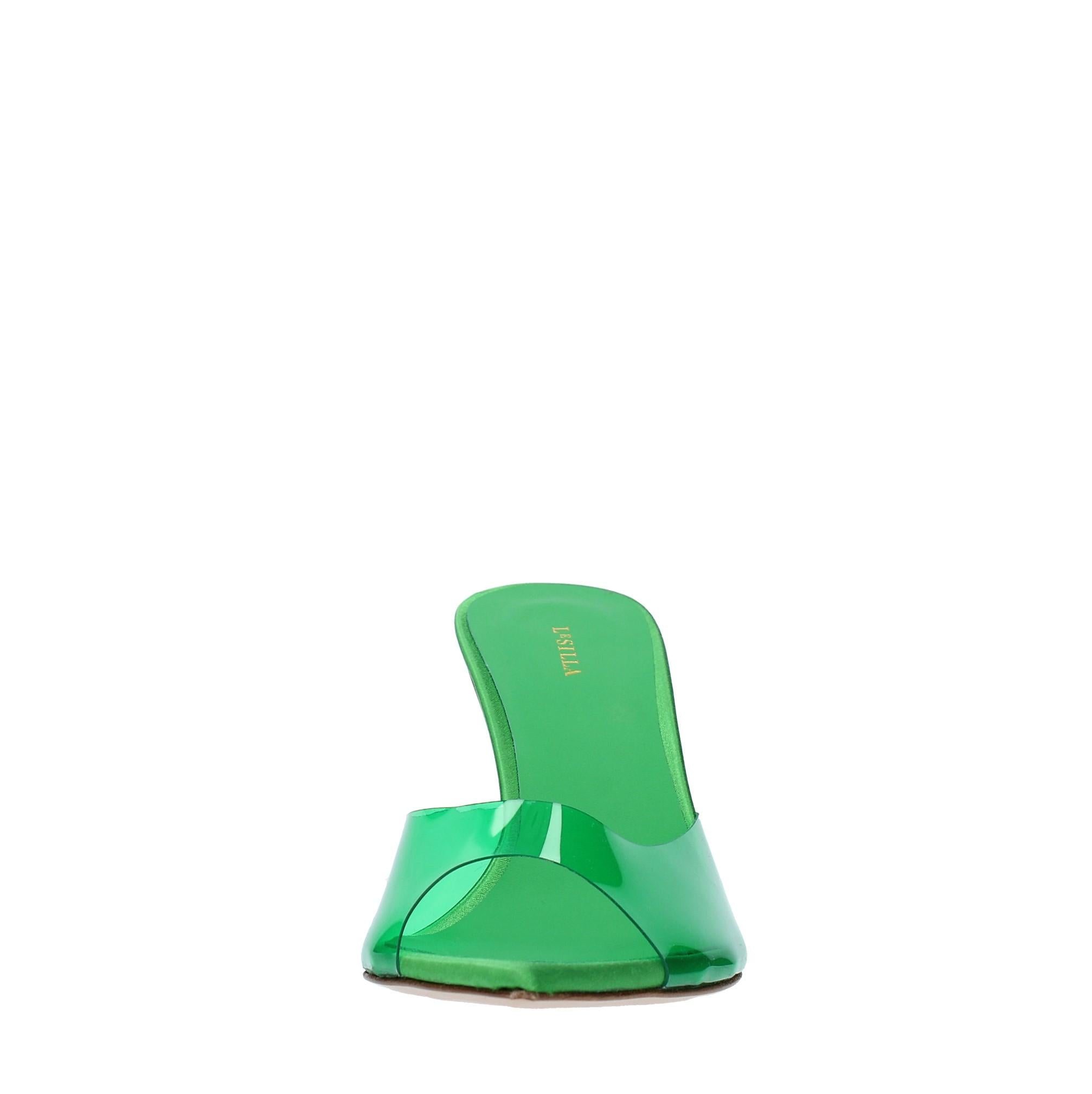Mules in pelle e PVC. 