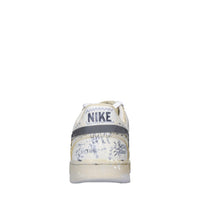 Sneakers in ecopelle e tessuto 