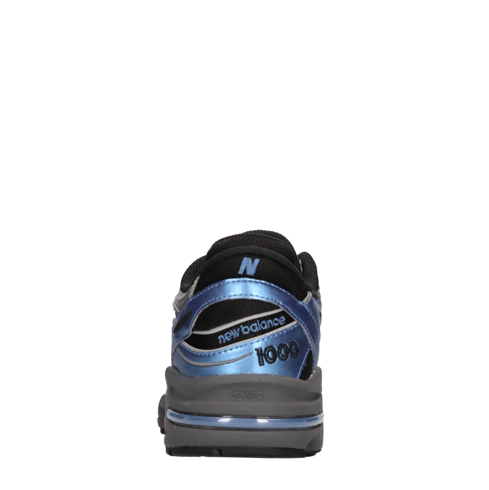 Sneakers in ecopelle e tessuto 