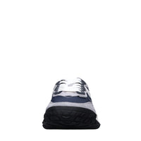 Sneakers in pelle e tessuto 