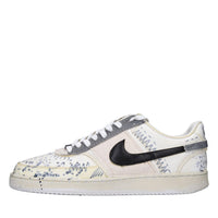 Sneakers in ecopelle e tessuto 