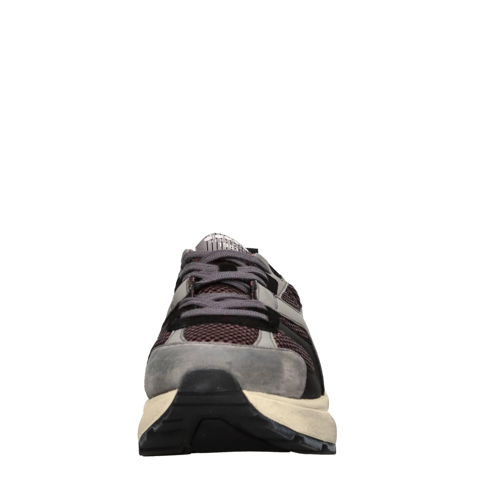 Sneakers in pelle e tessuto 