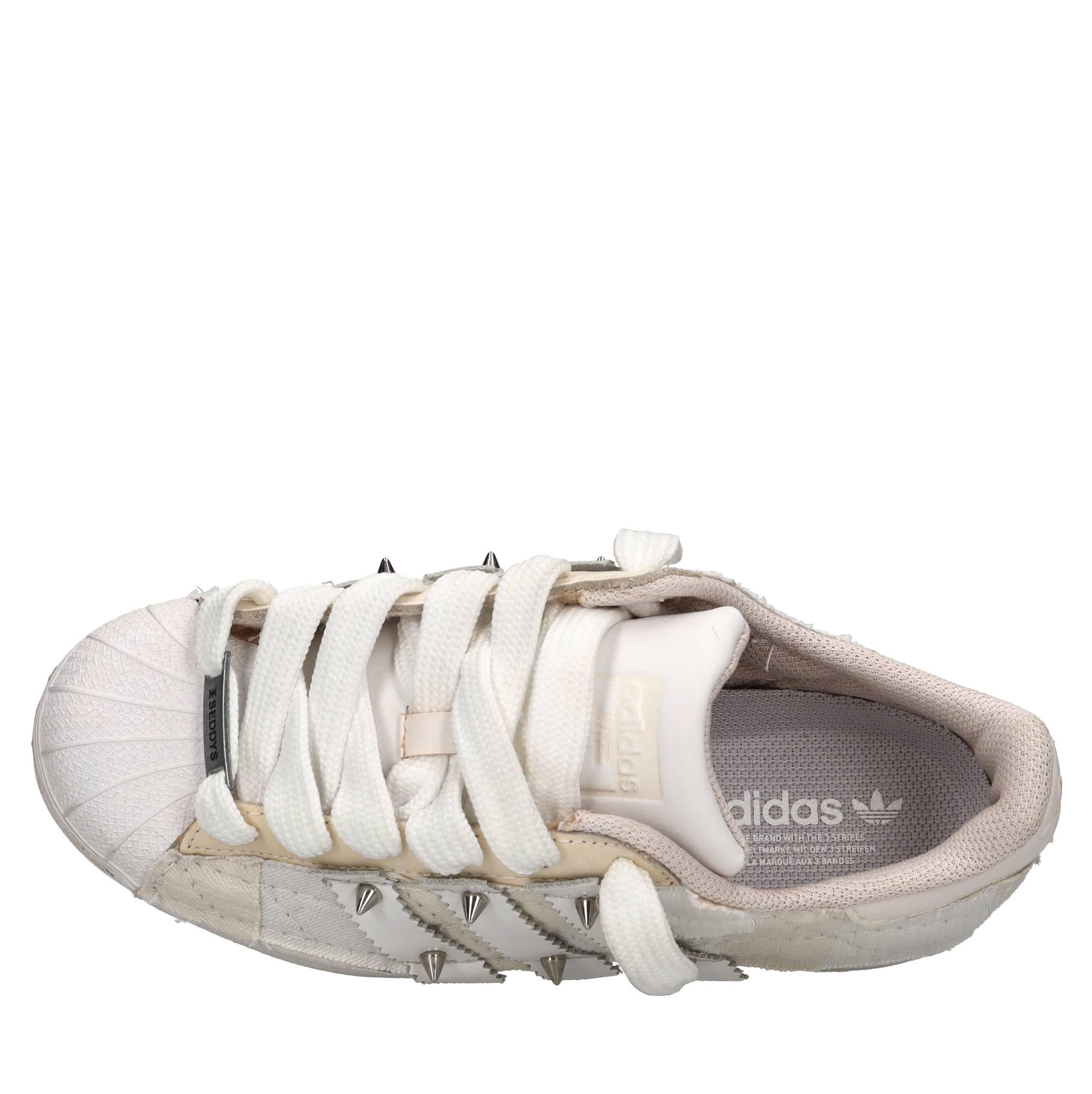 Sneakers in ecopelle e tessuto 