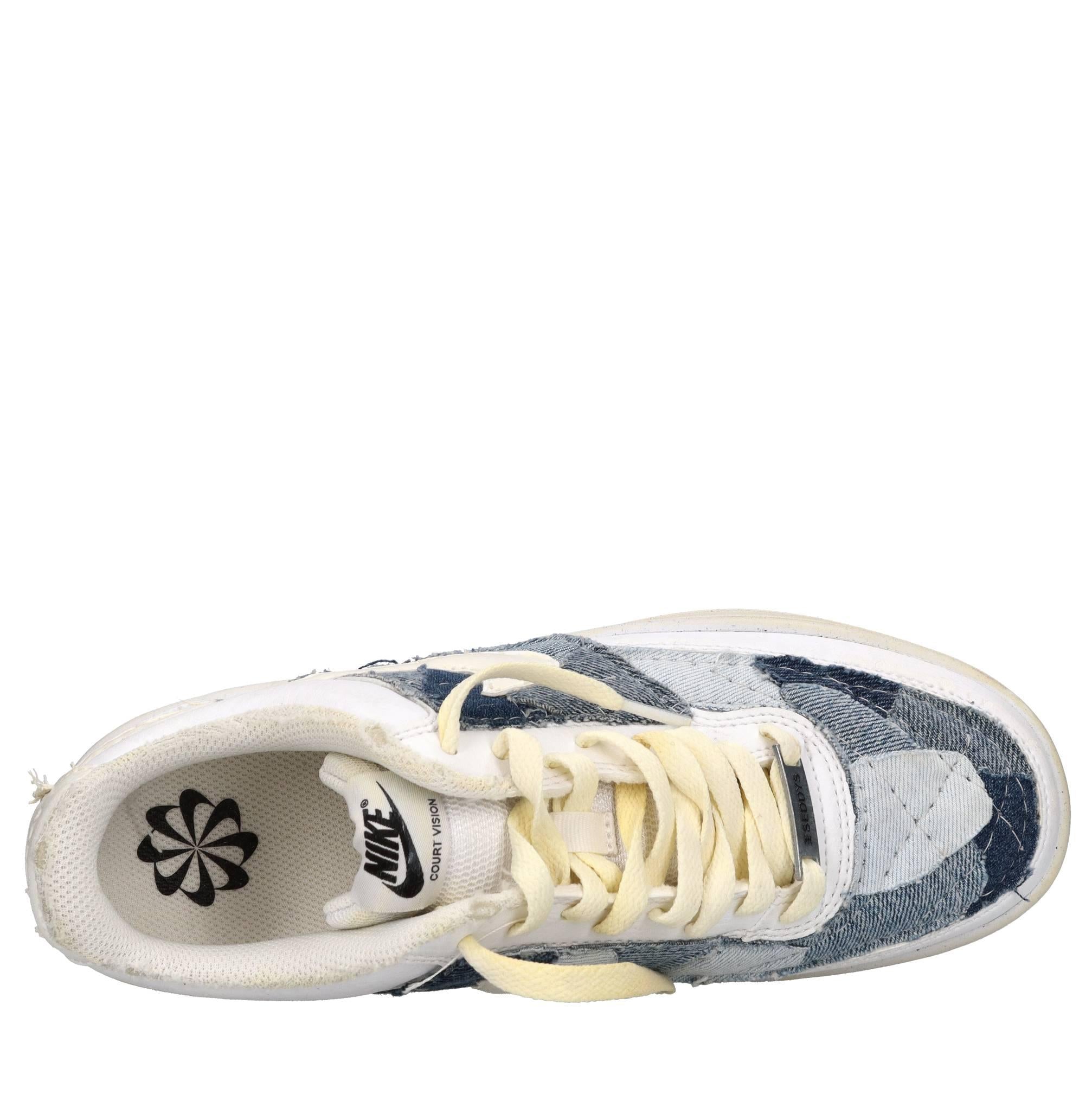 Sneakers in ecopelle e tessuto 