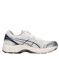 Sneakers in ecopelle e tessuto 