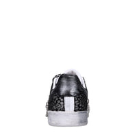 Sneakers in pelle e tessuto 
