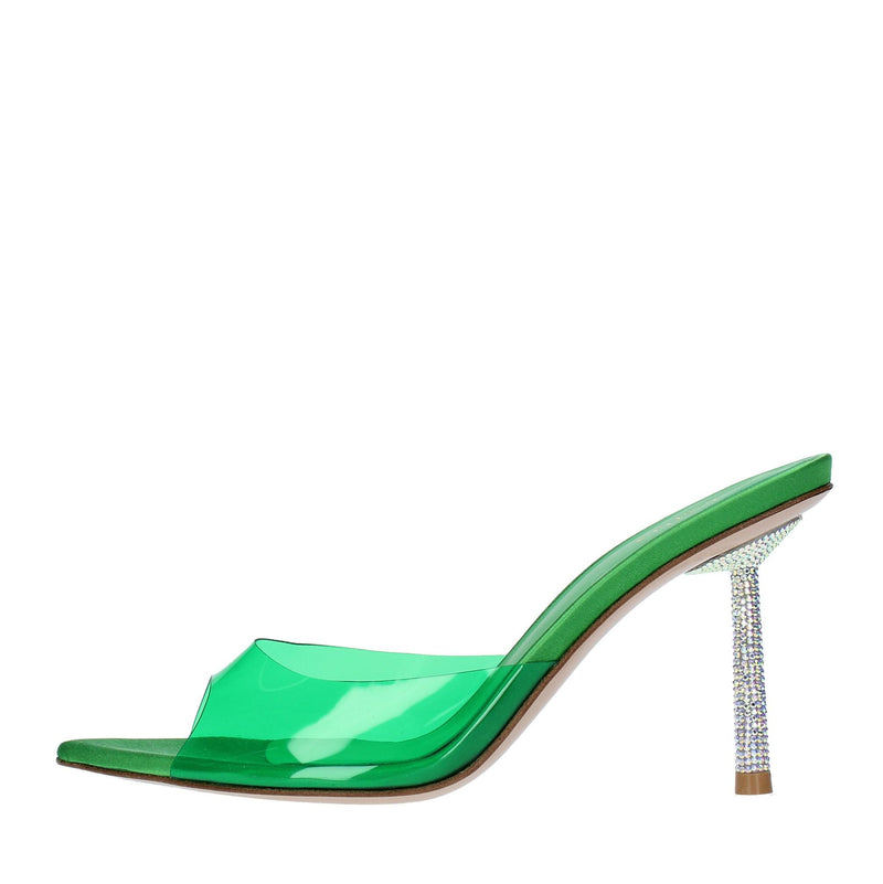 Mules in pelle e PVC. 