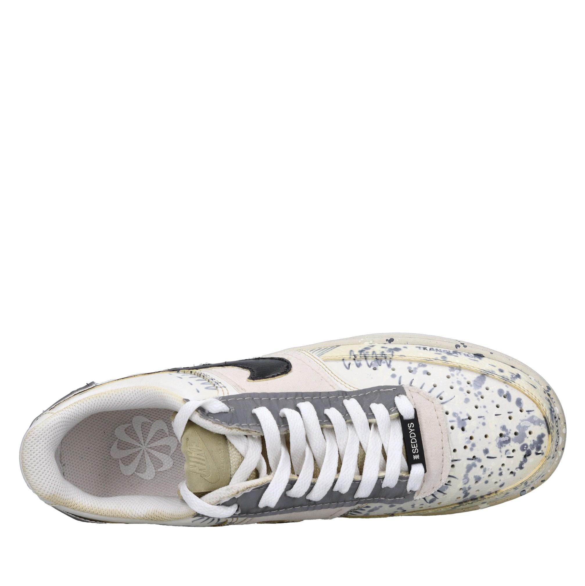 Sneakers in ecopelle e tessuto 