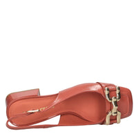 Décolleté slingback in pelle lucida 