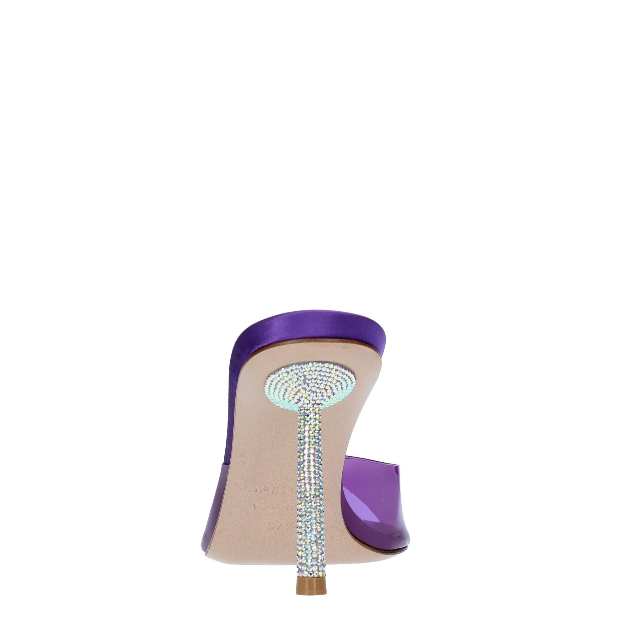 Mules in pelle e PVC 