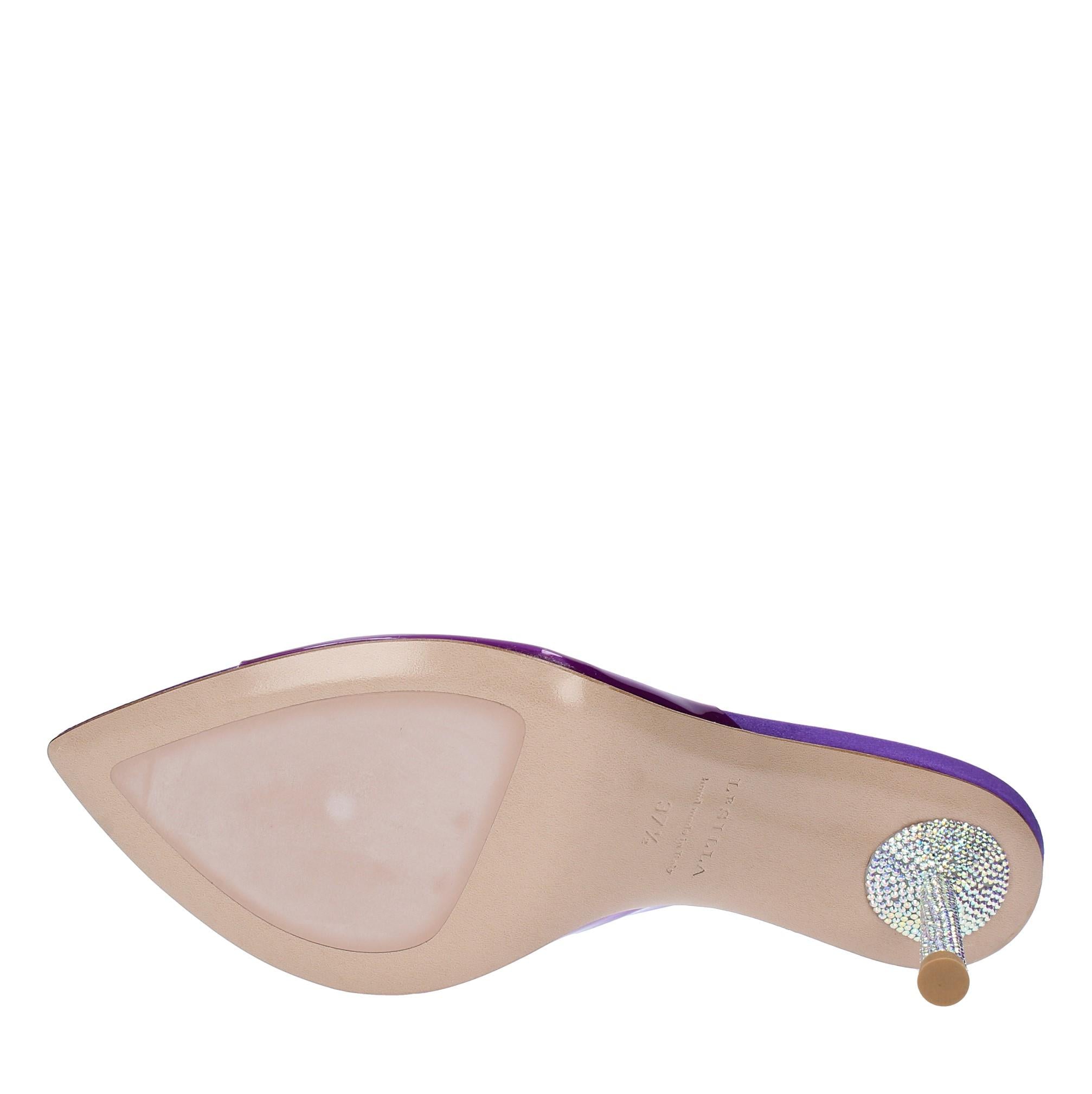 Mules in pelle e PVC 