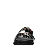 Mules in camoscio e pelle con borchie 
