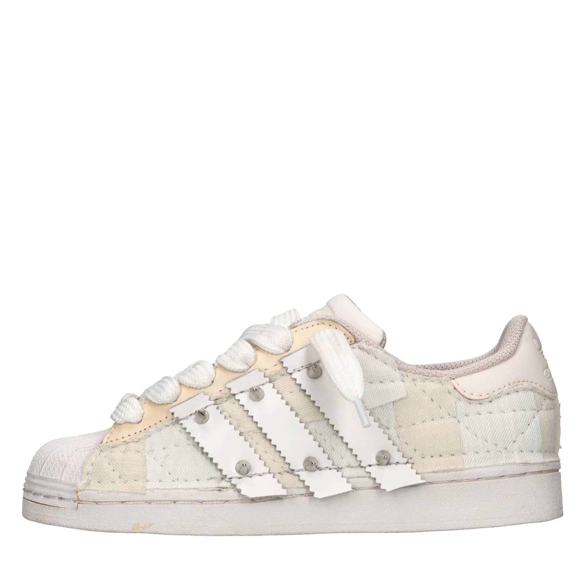 Sneakers in ecopelle e tessuto 
