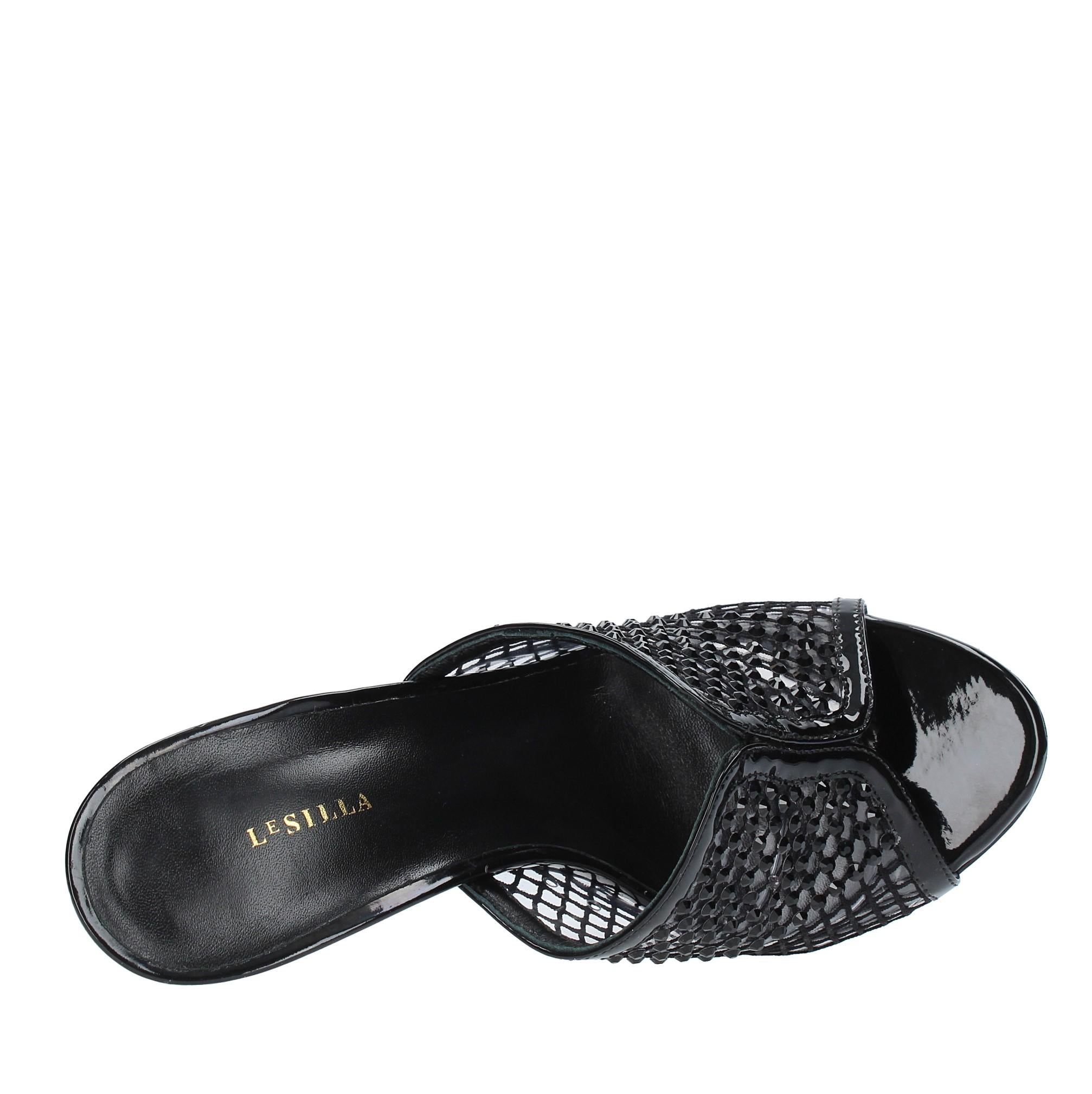 Mules in pelle tessuto e PVC 